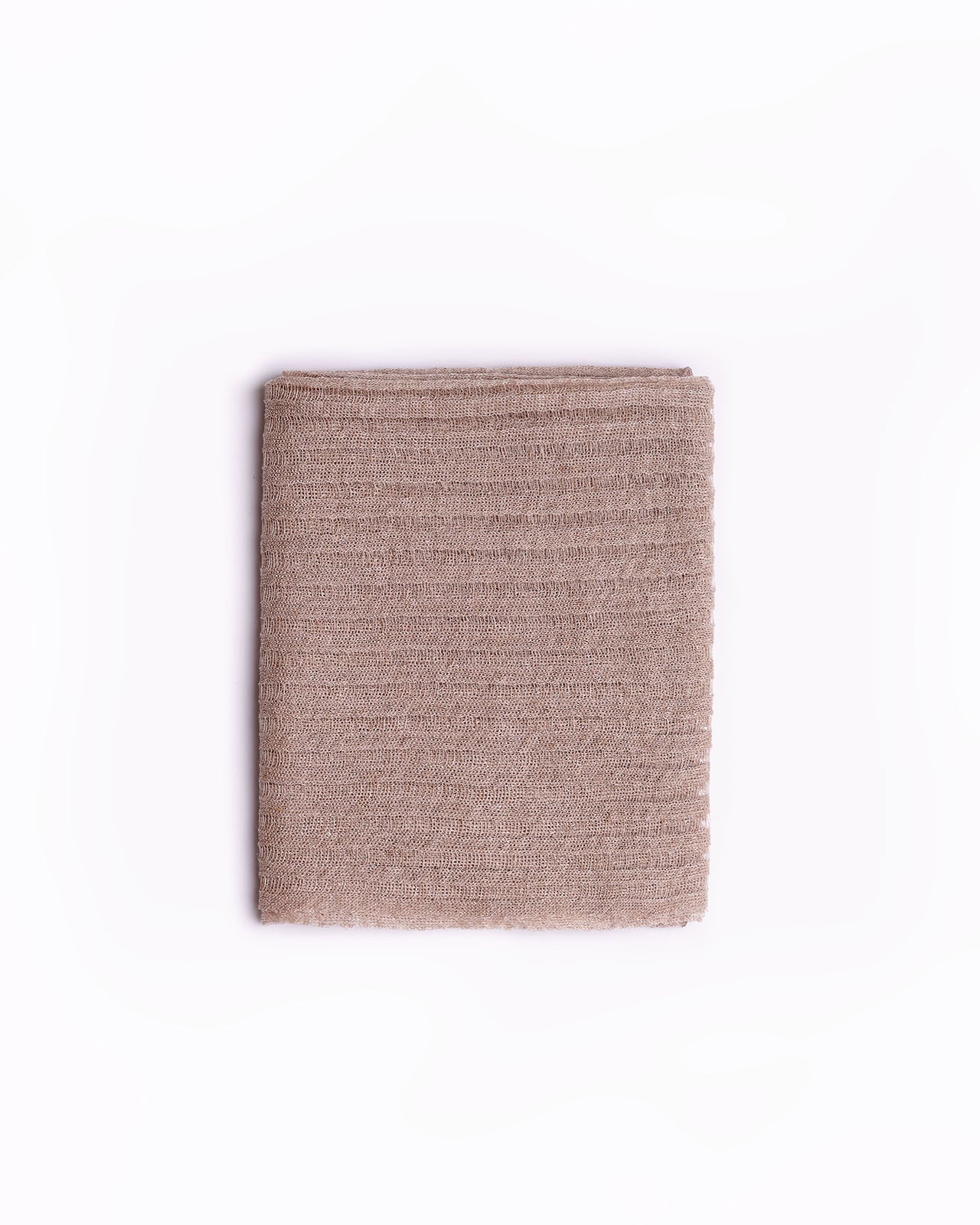 High-quality image of a neatly folded natural linen scarf in a neutral beige color, showcasing its textured weave. This elegant scarf is perfect for adding a touch of sophistication to any wardrobe, ideal for both casual and formal occasions. Its simple yet stylish design and versatile color make it an essential accessory for fashion-forward individuals.