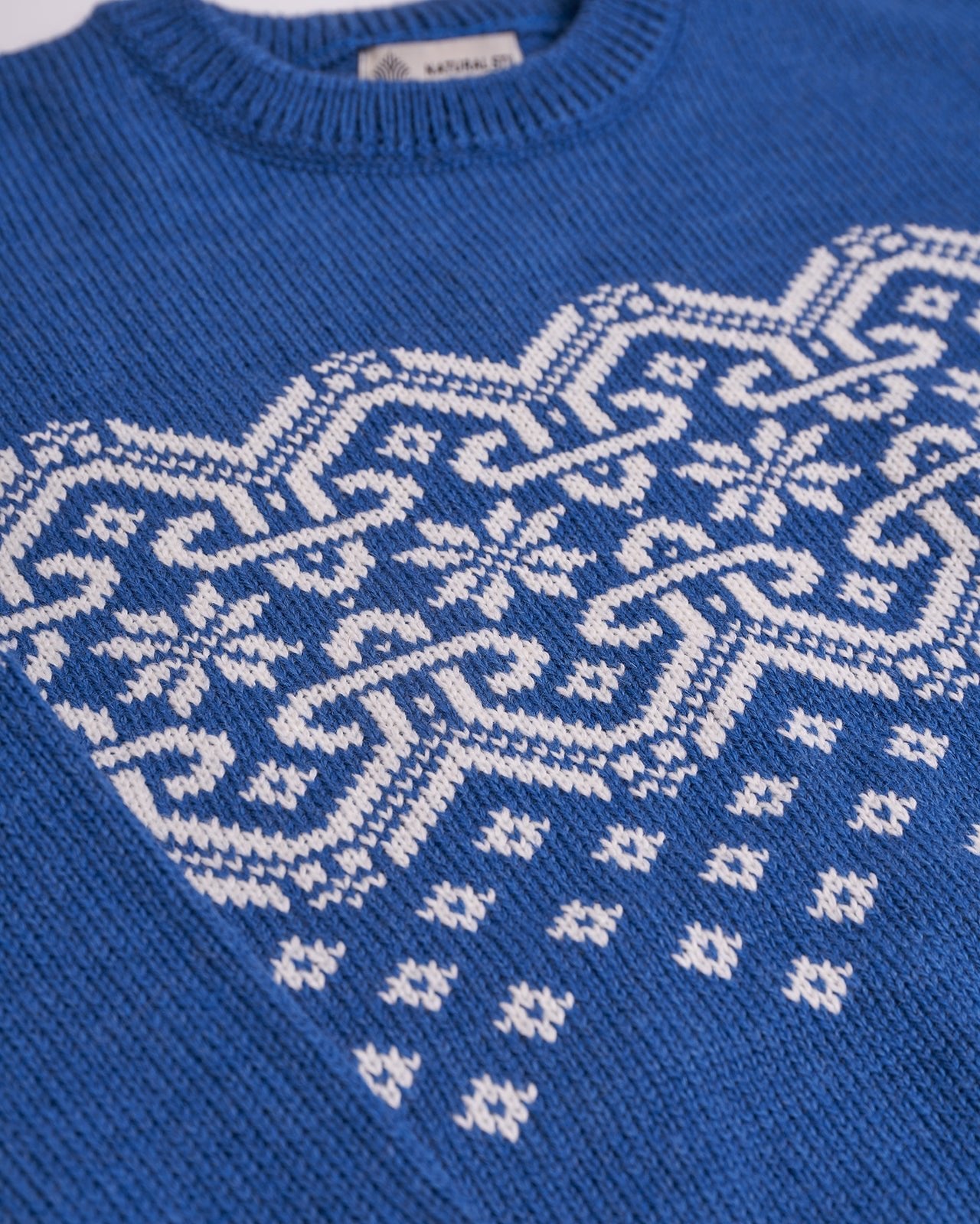 blue sweater with ornament